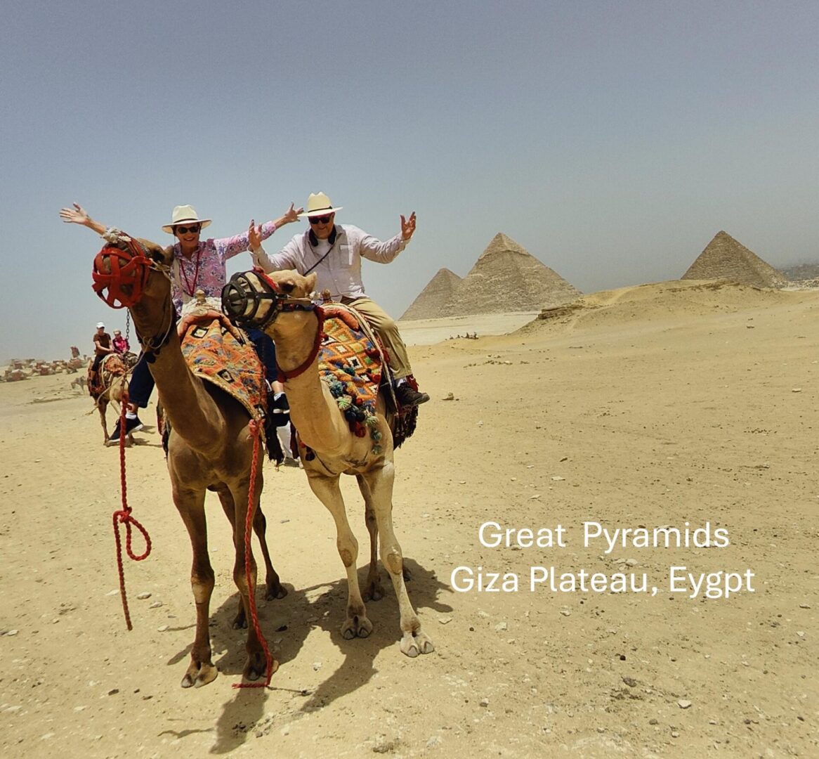 Realtor Jack Foster of Kerri Real Estate riding a camel at the Great Pyramids in Giza Plateau Egypt